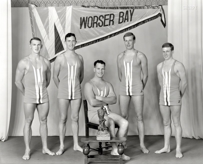 Wellington, New Zealand. "Worser Bay Surf Life Saving Club, team of 1962, with Cook Strait trophy." Seated: Barrie Davenport, first person to swim Cook Strait. Large format negative by Crown Studios, Wellington. View full size.
