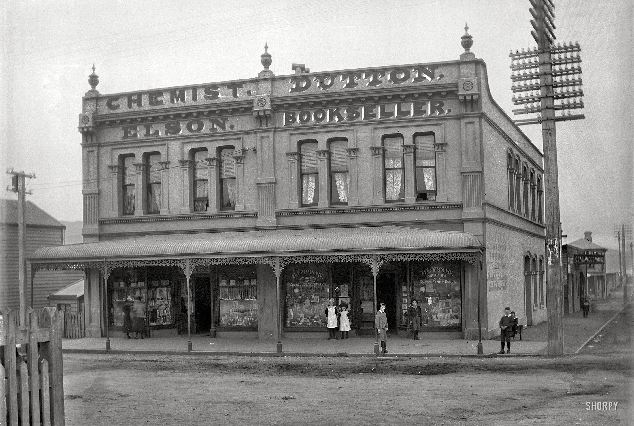 "Elson chemist and Dutton bookshop on Courtenay Place, Wellington, between 1896 and 1897." Glass negative by Frederick James Halse. View full size.