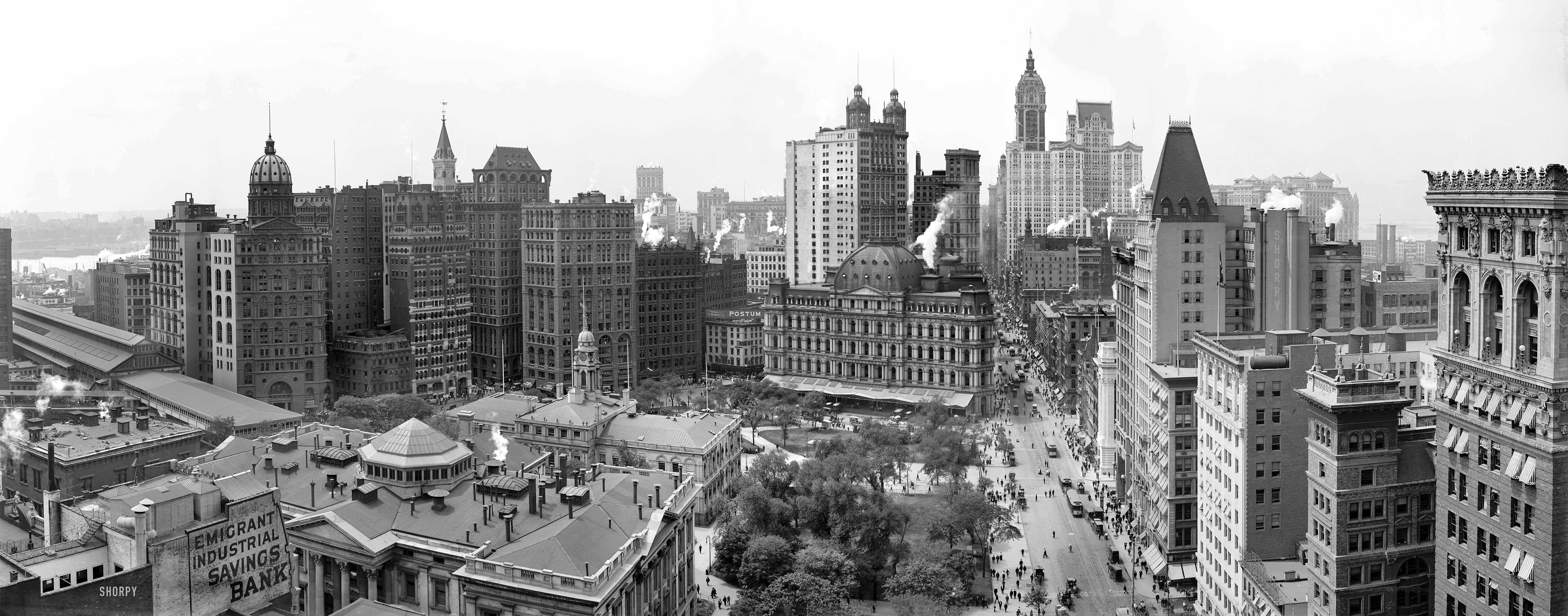 Manhattan circa 1908. "The Heart of New York." Landmarks in this panorama of four 8x10 glass plates include Broadway, City Hall Park, the City Hall Post Office, the Singer, Park Row, Home Life Insurance and City Investing buildings and, far left, Manhattan Terminal. Note the observer taking in the scene from the cupola atop the domed New York World building. Detroit Publishing Co. View full size.