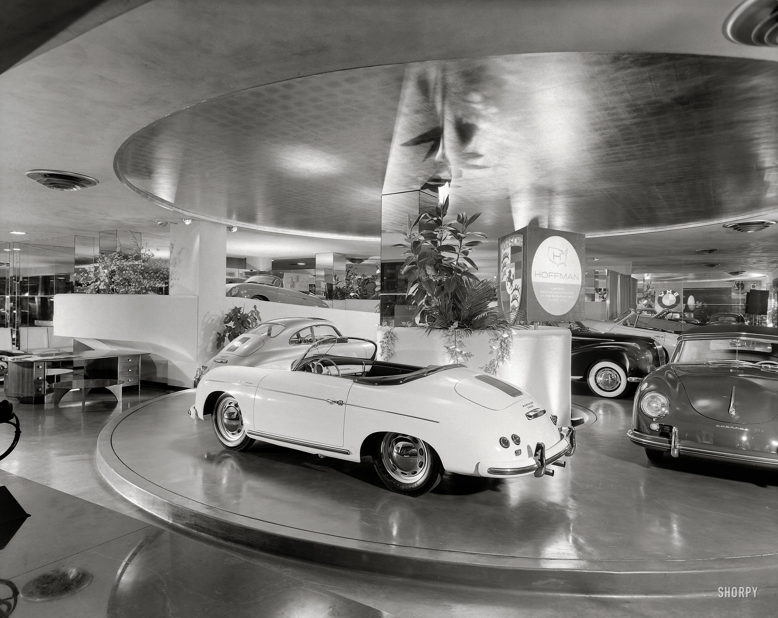 New York circa 1955. The Max Hoffman car showroom, with its motorized turntable, at 430 Park Avenue and 56th Street. Designed by Frank Lloyd Wright and recently demolished. Photo by Ezra Stoller. View full size.