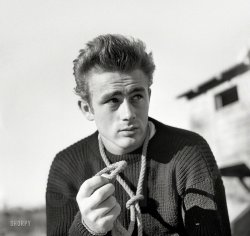 November 23, 1954. "Actor James Dean in front of old building." From photographs by Maurice Terrell used in the postmortem (1956) Look magazine profile "James Dean: The Legend and the Facts." View full size.
