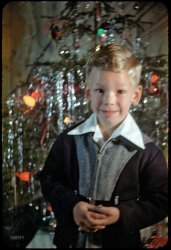 "Xmas 1951." Shorpy and our young, out-of-focus Michigander want to wish you all a very merry Christmas. And now if you'll excuse us, we have to get to bed before Santa gets here! 35mm Kodachrome slide. View full size.