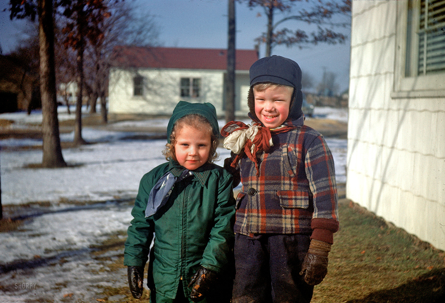 "Winter 1951-52." Our young man has a flair for fashion, and a way with the ladies. Fourth in this series of found slides. 35mm Kodachrome. View full size.