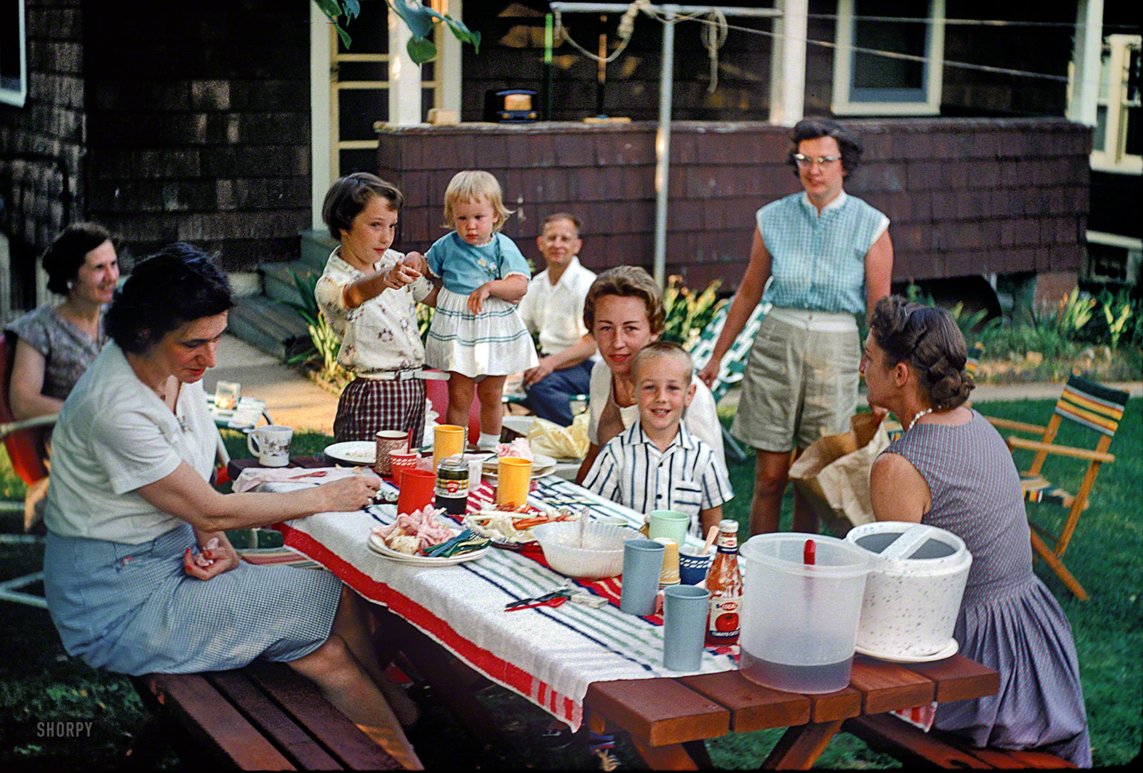 &nbsp; &nbsp; &nbsp; &nbsp; We dedicate this golden (Kodachrome) oldie to picnic-partakers everywhere. Happy Memorial Day weekend from Shorpy!
June 1960 somewhere in Maryland. "Picnic in yard." Janet, of Kermy and Janet, pointing at the camera. Who wants more potato salad? View full size.