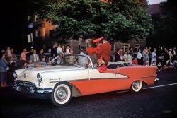 "Circus parade, 1958." Mr. Bear in a 1955 Oldsmobile Starfire, probably in Baltimore. From the Kermy & Janet collection of Kodachromes. View full size.