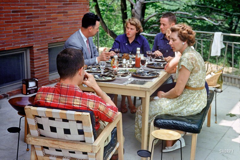 Alfresco dining on the patio circa 1952 in this unlabeled Kodachrome. Do I hear Brubeck on the hi-fi? Third in the "Linda" series of 35mm slides. View full size.
