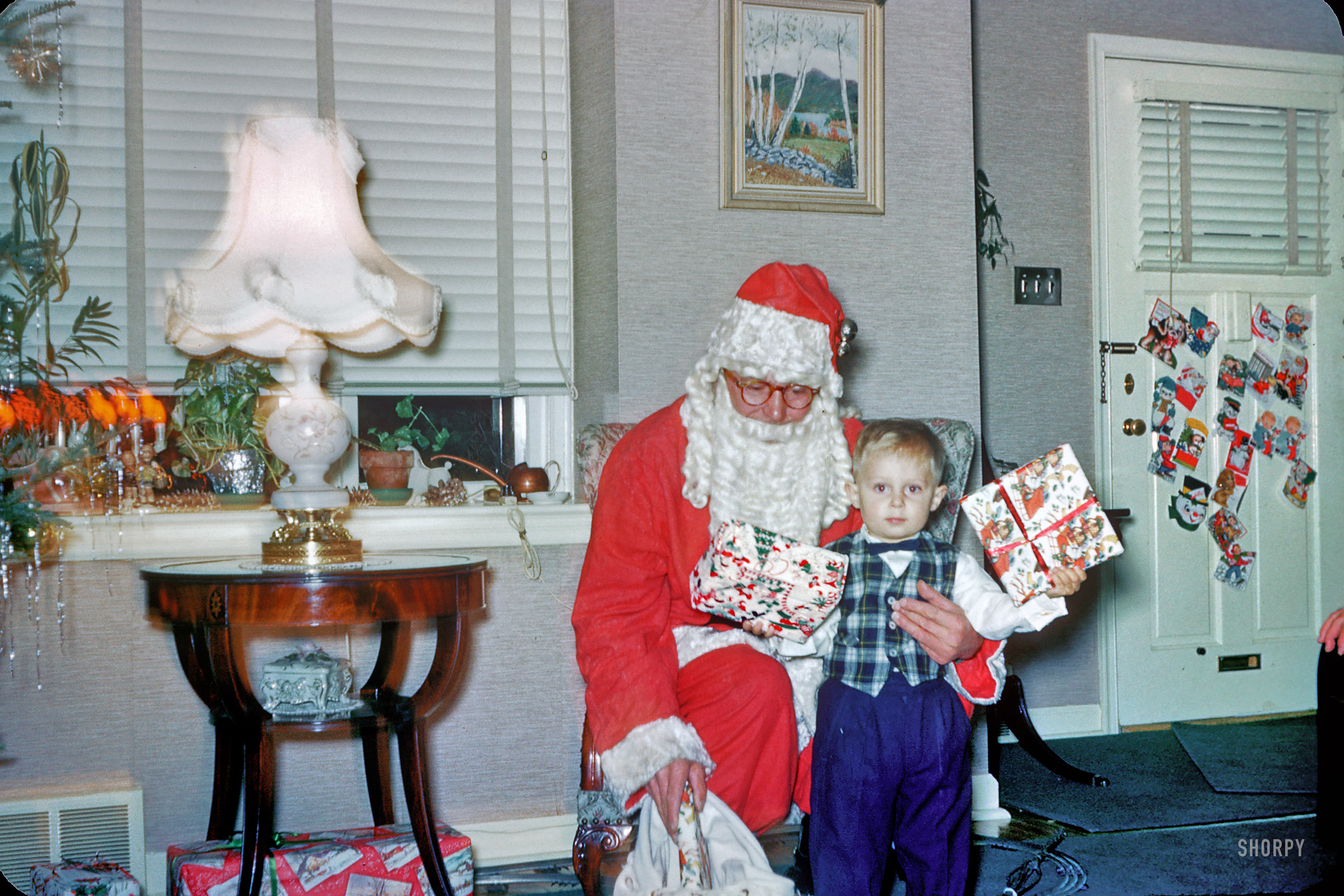 Pennsylvania circa 1958. This little boy was evidently on the "nice" list. (Isn't it funny how Santa and Uncle Bert have the same eyeglasses?) Note the abundance of mid-century tchotchkes. 35mm Kodachrome found on eBay. View full size.