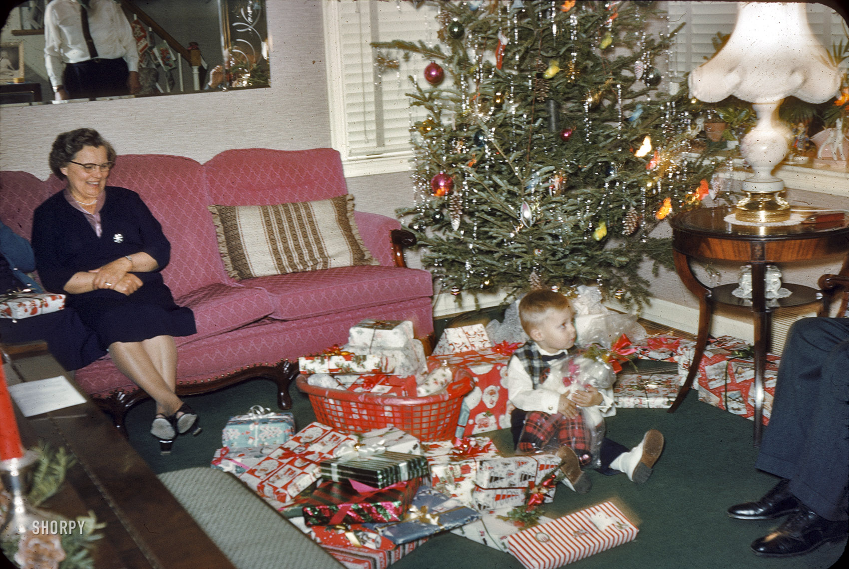 Our young Pennsylvanian at the intersection of Christmas Past and Christmas presents, shortly before he disappeared in an avalanche of gift wrap. Merry Christmas from Shorpy! 35mm Kodachrome slide. View full size.