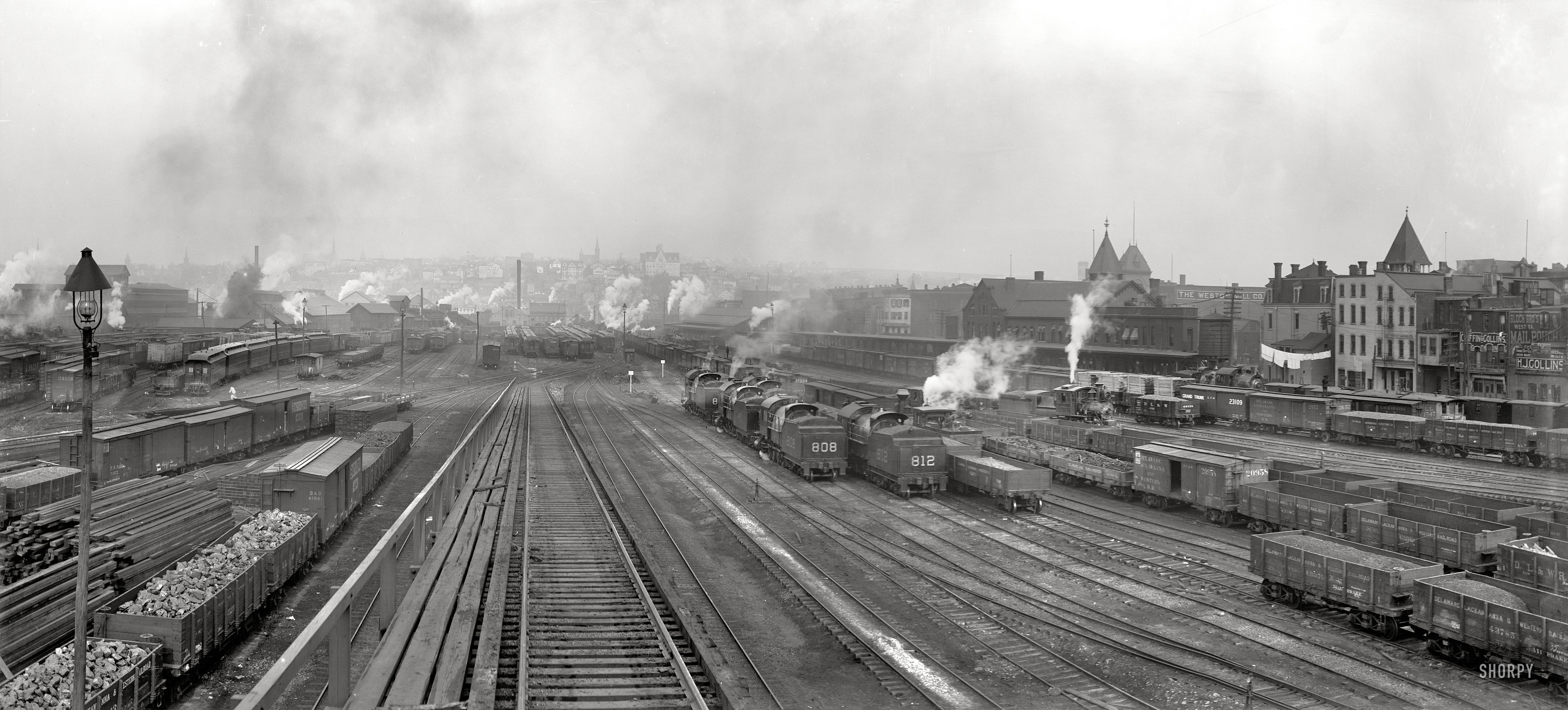 Scranton, Pennsylvania, circa 1900. "Delaware, Lackawanna, and Western Railroad yards." Panorama of two 8x10 inch glass negatives. We've seen the left half of this view before; the right side, with someone's laundry billowing bravely amid the the soot, is new. Detroit Publishing Company. View full size.