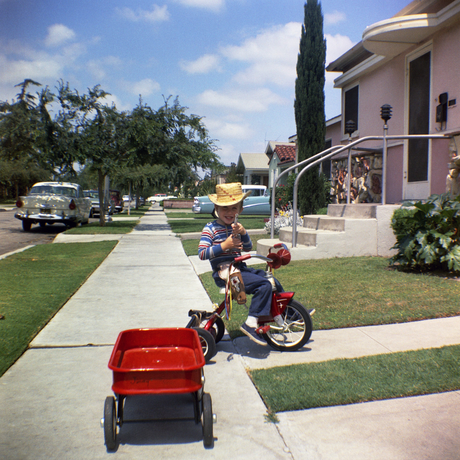 I just started scanning my sister's photos of her kids from the 1960s. Here's why she was smart to have saved the negatives. Back in 1963, they lived in South Gate, California, in a neighborhood full of classic cars, it seems. My nephew Jimmy in a 2¼-inch square Kodacolor negative. View full size.