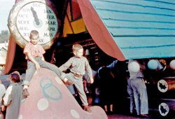 This photo was taken of my brother and me on a 1958 visit to Santa's Village near Los Angeles, at Skyforest, near Lake Arrowhead in the San Bernardino Mountains. We lived just south of San Francisco at the time, but all the relatives were in the Los Angelas area, so every year we'd make our annual Christmas trip to LA. As you can see by the clock overhead, Christmas is fast approaching! 
(ShorpyBlog, Member Gallery)