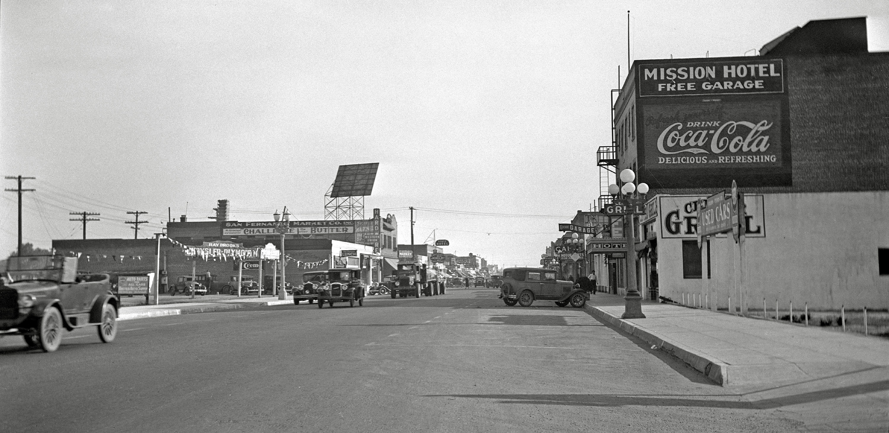 "Main commercial street in San Fernando California"  October 1931. Scanned from a 3"x5" negative from a collection of newspaper negatives found in a second-hand store. View full size.