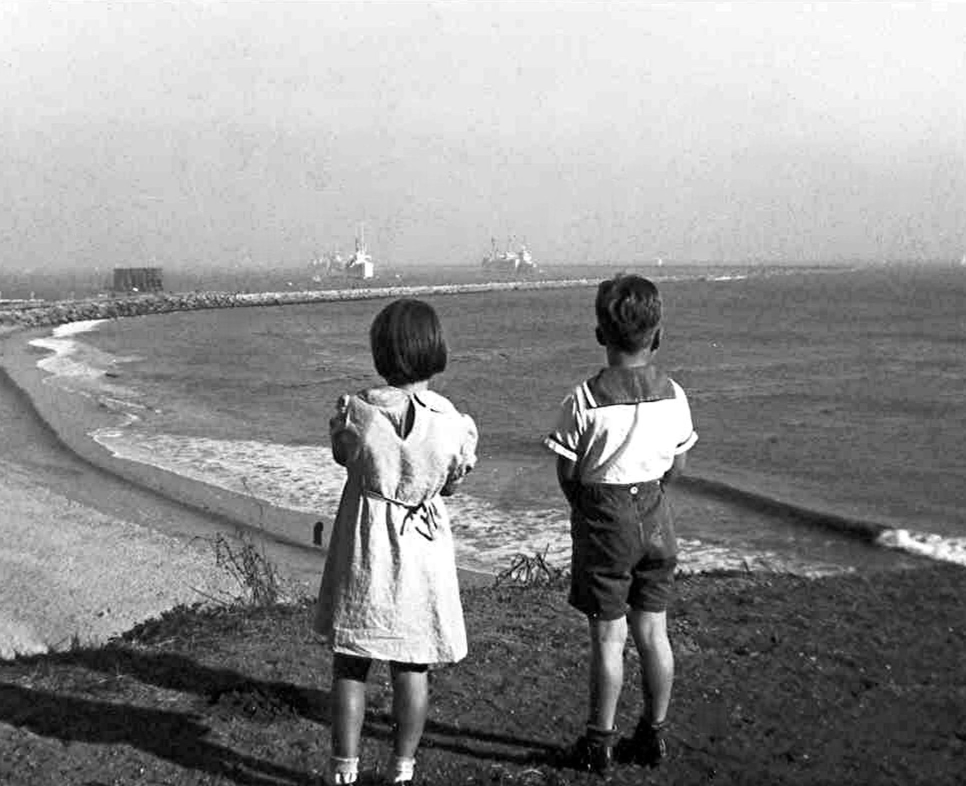 My sister and I viewing the San Pedro coastline in 1935.  I can't understand why my outfit ever went out of style.