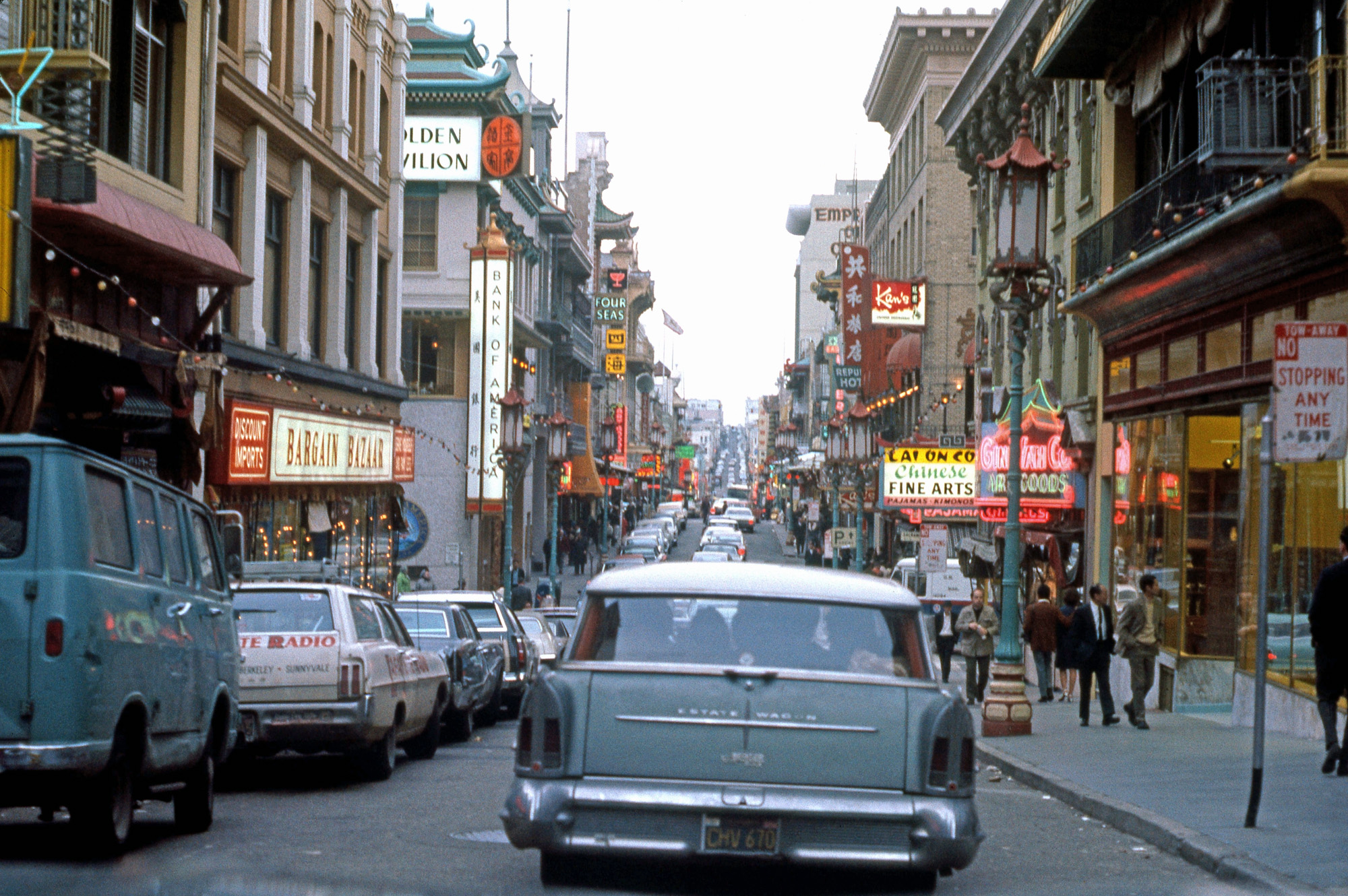 San Francisco, March 1969. Lots of variety in vehicles, parked and moving. The 1958 Buick Estate Wagon ahead is a rare one today. Taken with a Pentax 35 mm SLR from the front seat of a car. View full size.