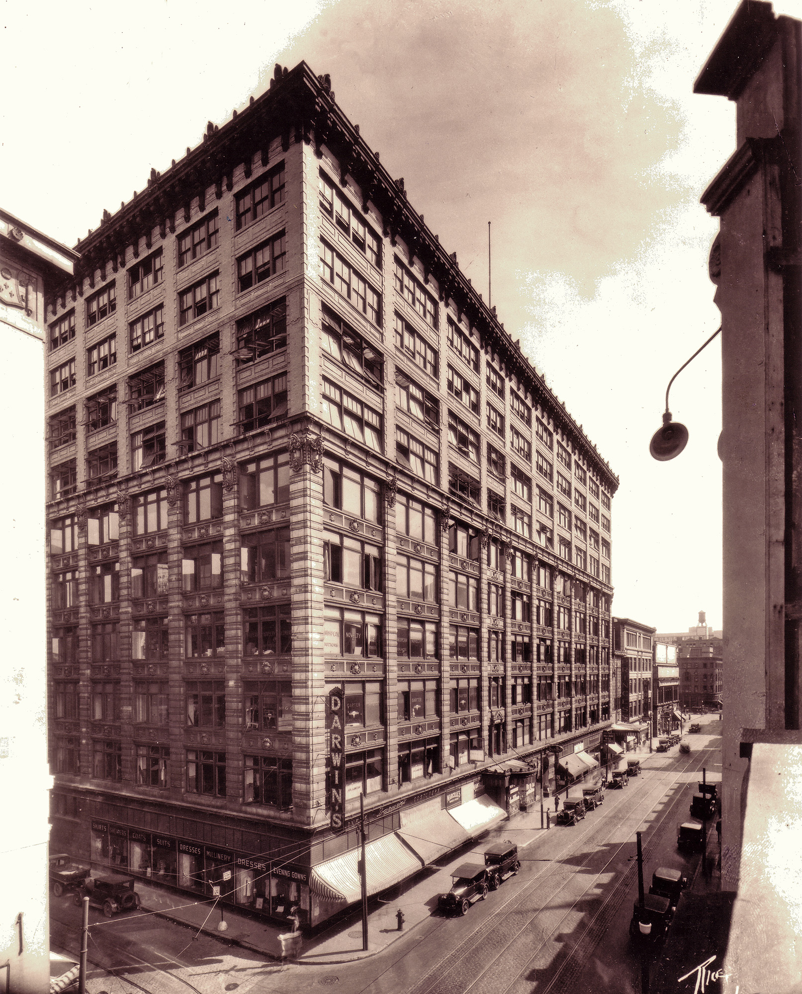 The Jacob Building was built in 1910 on the corner of St. Catherine West and St. Alexander Streets in downtown Montreal, Quebec. I am a property administrator in this building and recently was cleaning some files and found this pic. It was shot in 1929 by well-known photographer of the time James Rice. View full size.