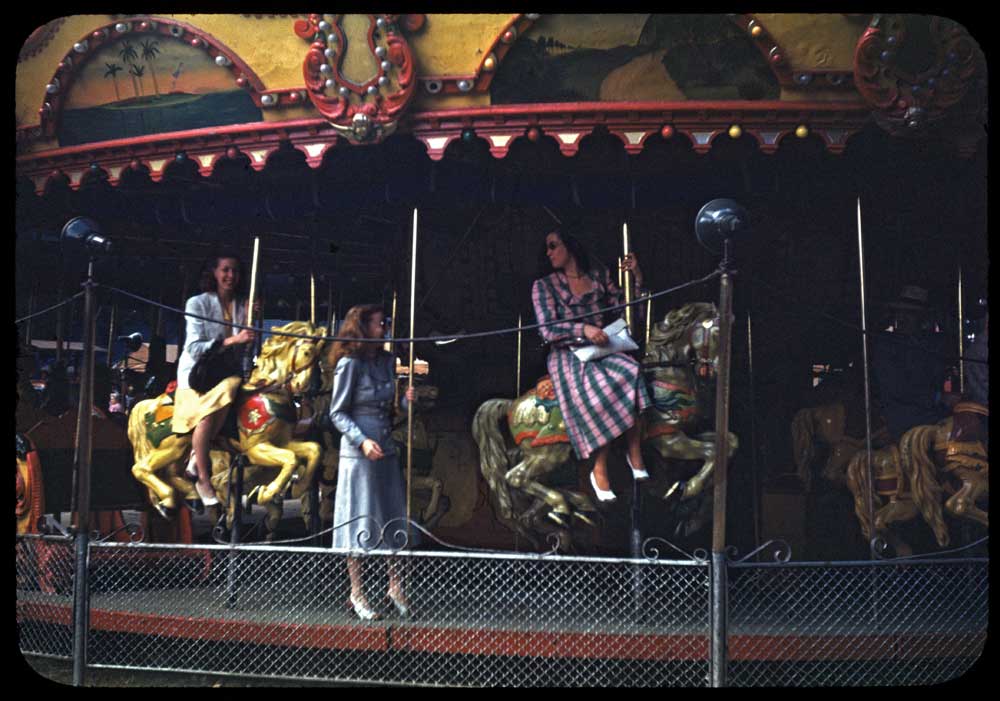 I first came across this image as a Kodachrome print in one of my Aunt's photo albums.  The picture was wallet sized but vibrant and intriguing.  Sure enough the original slide appeared and I scanned it to present it here.  I'm not sure of the location.  It might be the amusement park that existed for years at the site of Mounds State Park (Anderson, IN) or possibly Riverside park in Indianapolis.  The identities of the ladies is unknown, but the more I look at it the more I think that the sidesaddle rider on the right could be my Aunt Emily.  The Kodachrome slide is undated but the print bears an imprint "This is a KODACHROME PRINT made by EASTMAN KODAK COMPANY T.M. Regis. U.S. Pat. Off. Nov. 23, 1948". View full size.