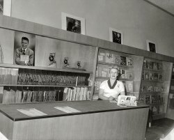 Our third look at the Holiday Shop record and camera store in Roeland Park, Kansas, circa 1950. Frank Sinatra is pictured on the wall. View full size.