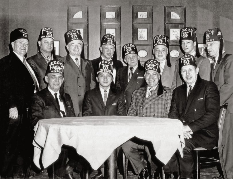 This image is of the New York City Mecca Shriners Divan and was taken at the Potentate's Ball sometime in the 1970's. Mecca Shrine is the first Shriners group ever. Formed by Freemasons in 1872, it is still very much in existence. View full size.
