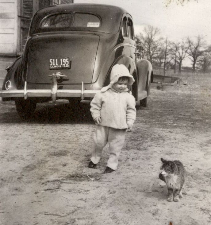 A cat attracts the attention of a baby who may be visiting with grandparents in Illinois. All I know for sure is the year is 1940, and this snapshot is from a series of photo pages that I found at a second hand store in Lancaster California. View full size.
