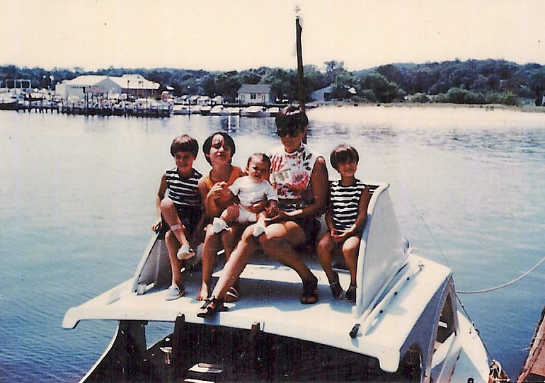 My four sisters and me on our family boat (1967). The boat was kept in a marina in Queens and we would spend our weekends and summers boating around Long Island. A favorite trip was to the Hamptons. Sounds fancy but, believe me, it wasn't. Not with six females on board. My father named the boat "Cuidado".  A shout-out my mother frequently used while a passenger in a car or boat, meaning "watch out" in Spanish. On the side of the boat my father, an artist, painted a baby bird hatching out of an egg with the beak wide open and the word "Cuidado" boldly painted.  He had a wonderful sense of humor. So did my mother. Thank God. View full size.