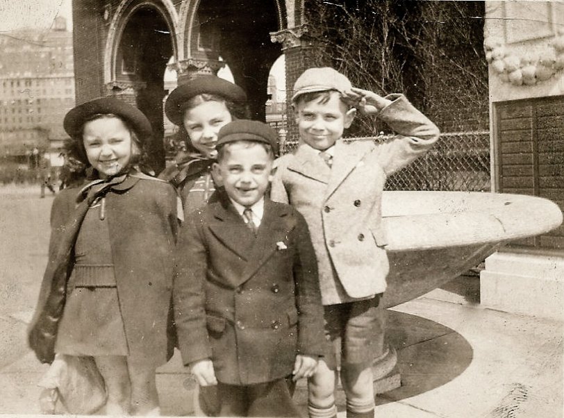 My mom and her sister on an outing to the Brooklyn Aquarium.  They lived in Brooklyn Heights and my grandfather would take them on outings on Sundays. Here they are pictured with two boys from the neighborhood. The boy who is saluting...His mom used to watch my mother and aunt while my grandmother worked. View full size.
