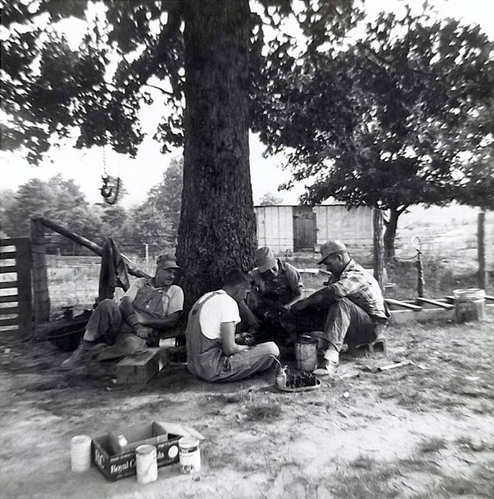 My father, grandfather and uncles working on an engine in the early 1960's in Double Springs (Winston County) Alabama. View full size.
