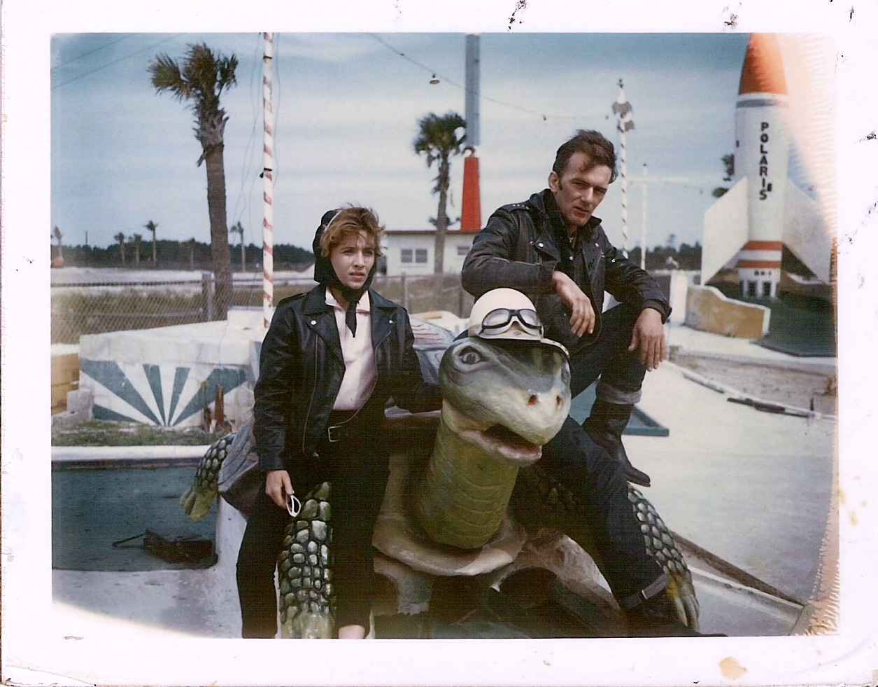 This photo is of my parents in 1963 on a Florida road trip. They are sitting on the back of a turtle in what looks to be a putt putt golf course. View full size.