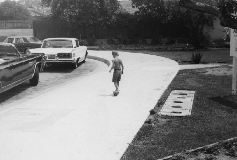 The photo of my father was taken in Southern California around 1965. I love the wide sidewalk. It's perfect for learning how to skateboard, a love which was passed down to my brother and me. View full size.
