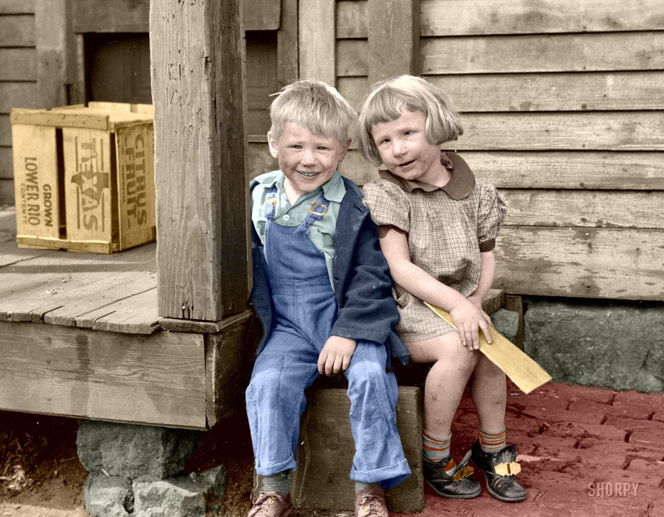 Slum Kids-II (Colorized) from Shorpy's files.
April 1940. Dubuque, Iowa. "Children who live in the slums." Our second look at this towheaded twosome, a sort of proto-Opie and his sister. 35mm nitrate negative by John Vachon for the Farm Security Administration. View full size