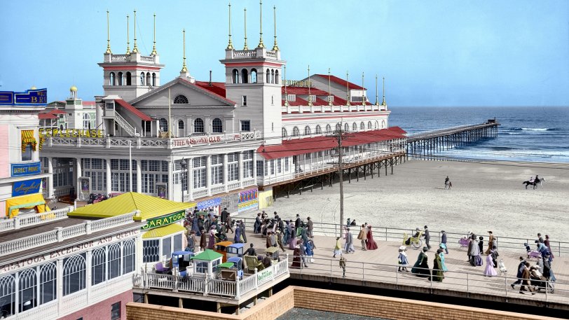 This is the second photo I've colorized, also of the Atlantic City boardwalk in 1905. The original is here. I've cropped the picture for display on my monitor, so the dimensions aren't identical.
I did some reading up on some of the elements of the picture.  The colors I used for the Steeplechase building itself are more or less historically accurate, based on some color(ed) postcards from the era. The colors on the other side of the boardwalk are less definite - my source postcards just show a lot of yellow over there, but without much definition.
Saratoga, Excelsior, and Quevic are all types of mineral water. View full size.

