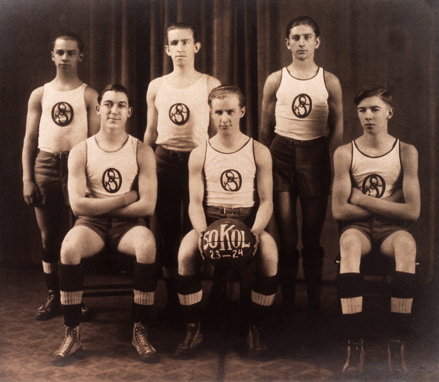 My dad Alois, (back row R) with his Sokol basketball teammates, 1923-1924. East St, Louis Czech Hall. The Sokol movement (from the Slavic word for falcon) is a youth sport movement and gymnastics organization first founded in Prague, Czechoslovakia. American Sokol is alive and well in the U.S. View full size.