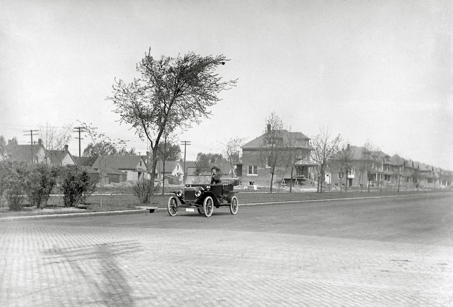 We found a box of 4X5 glass plate negatives in my parents' basement years back.  We're assuming the photographer was somebody in my family.  Pics were taken in and around the Detroit, Michigan. I think this may be a 1908 Model T Ford. View full size.