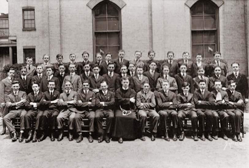 My grandfather (middle row, fourth from left) attended St. Francis Academy on Baltic St. in Brooklyn. Here he is with classmates in what I believe was a senior class picture, c. 1918. The school has relocated and is now known as St. Francis Prep. Vince Lombardi and Joe Torre both attended the school. View full size.
