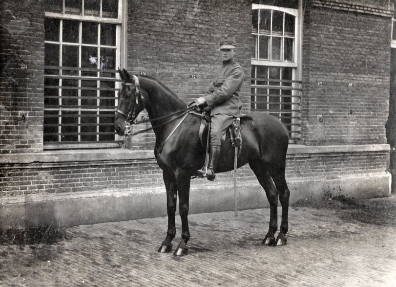 My father as a conscript with the Dutch horse-drawn artillery. The photo was taken in The Hague in the early 1920s. The barracks were called 'Frederik kazerne'. All you can see in this picture has long gone. View full size.

