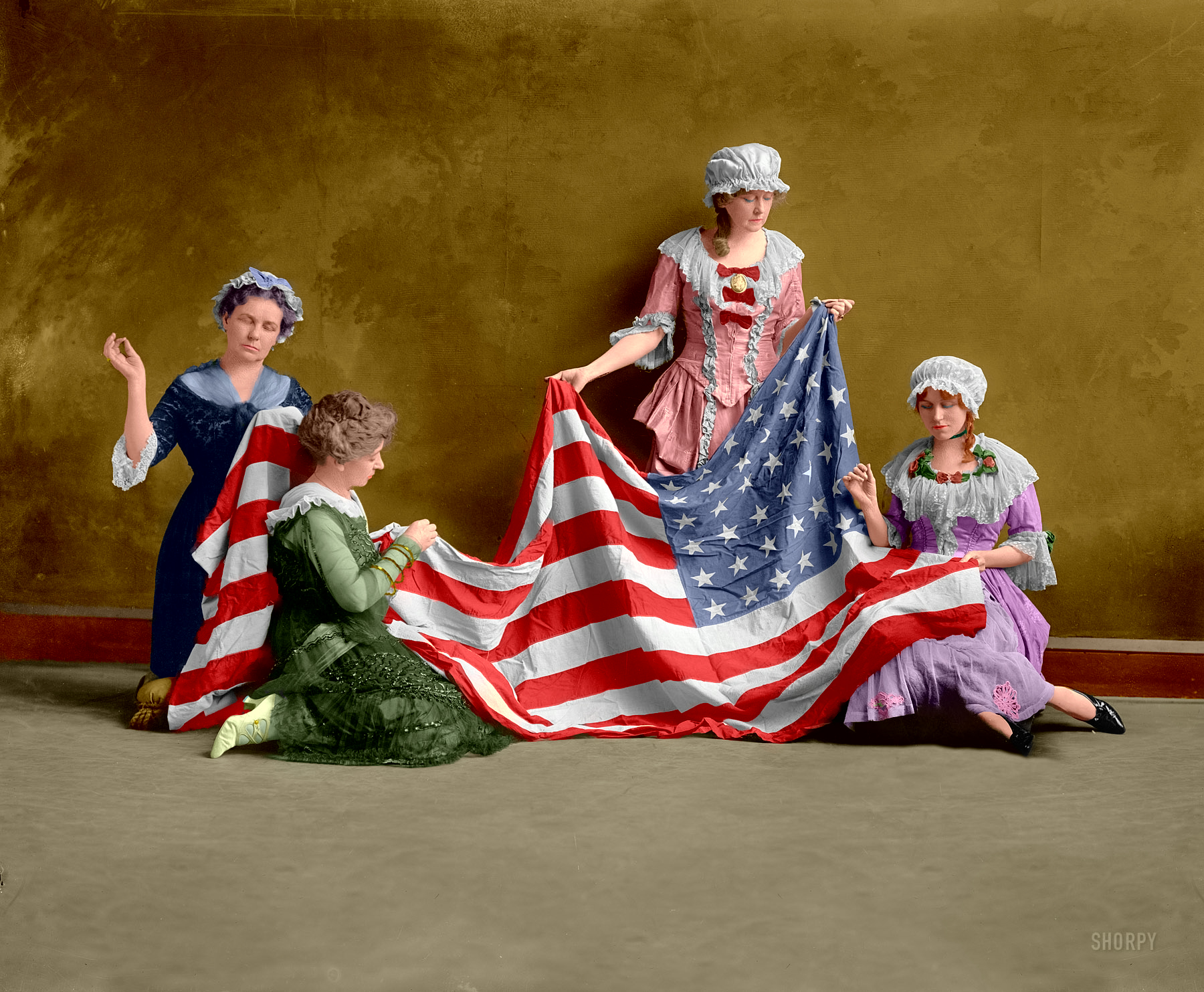 I planned to hold off on uploading any more colorized images for about a week or two, but these ladies and Old Glory just seemed so right for color I couldn't resist. And now was the time to get them colorized and uploaded. View full size.