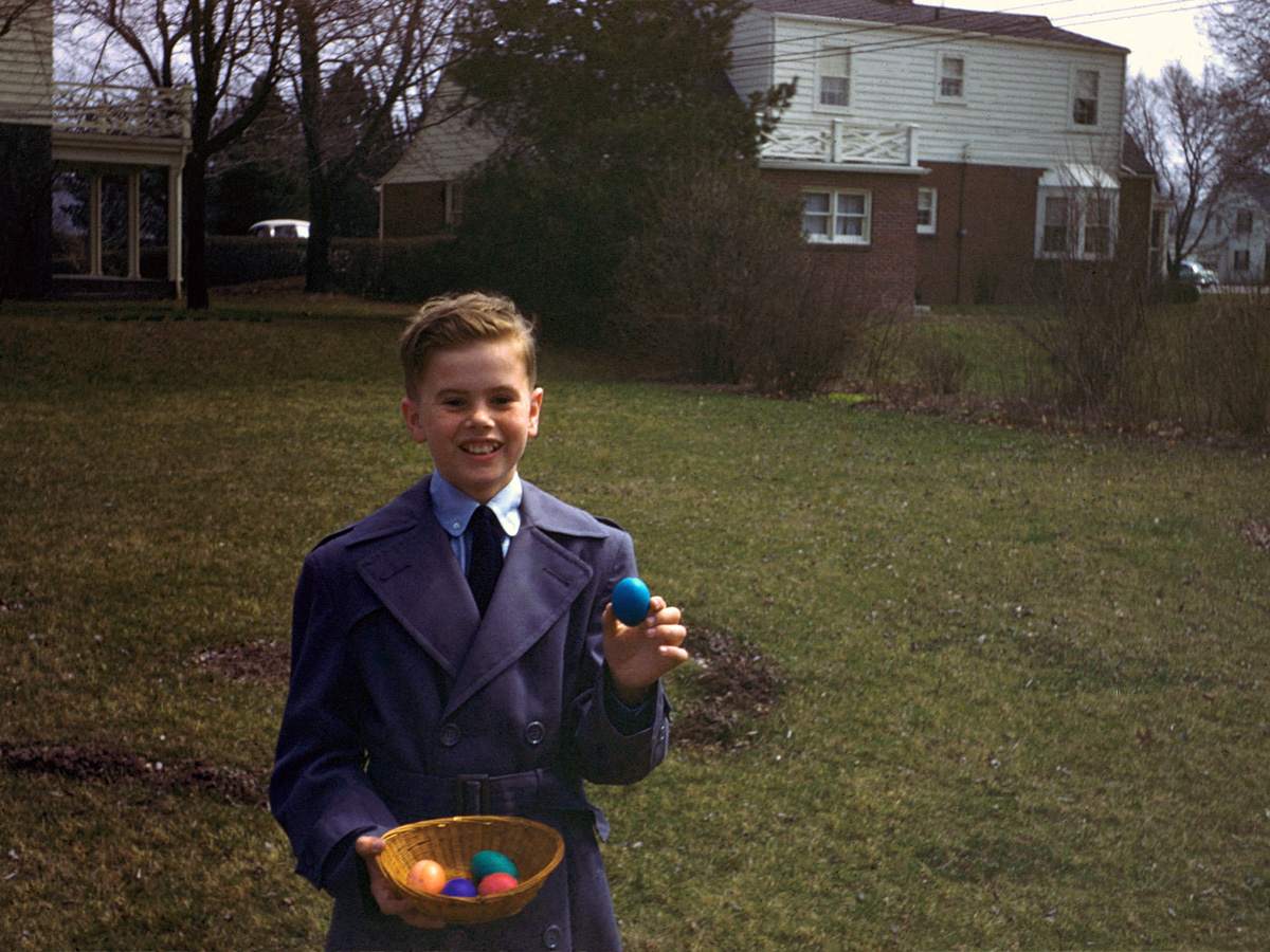 My cousin Stephen hunting Easter eggs at our grandmother's house in Anderson, Indiana. Probably the mid-1950s. Scanned from a 35mm Kodachrome transparency likely taken by our Aunt Lee. View full size.