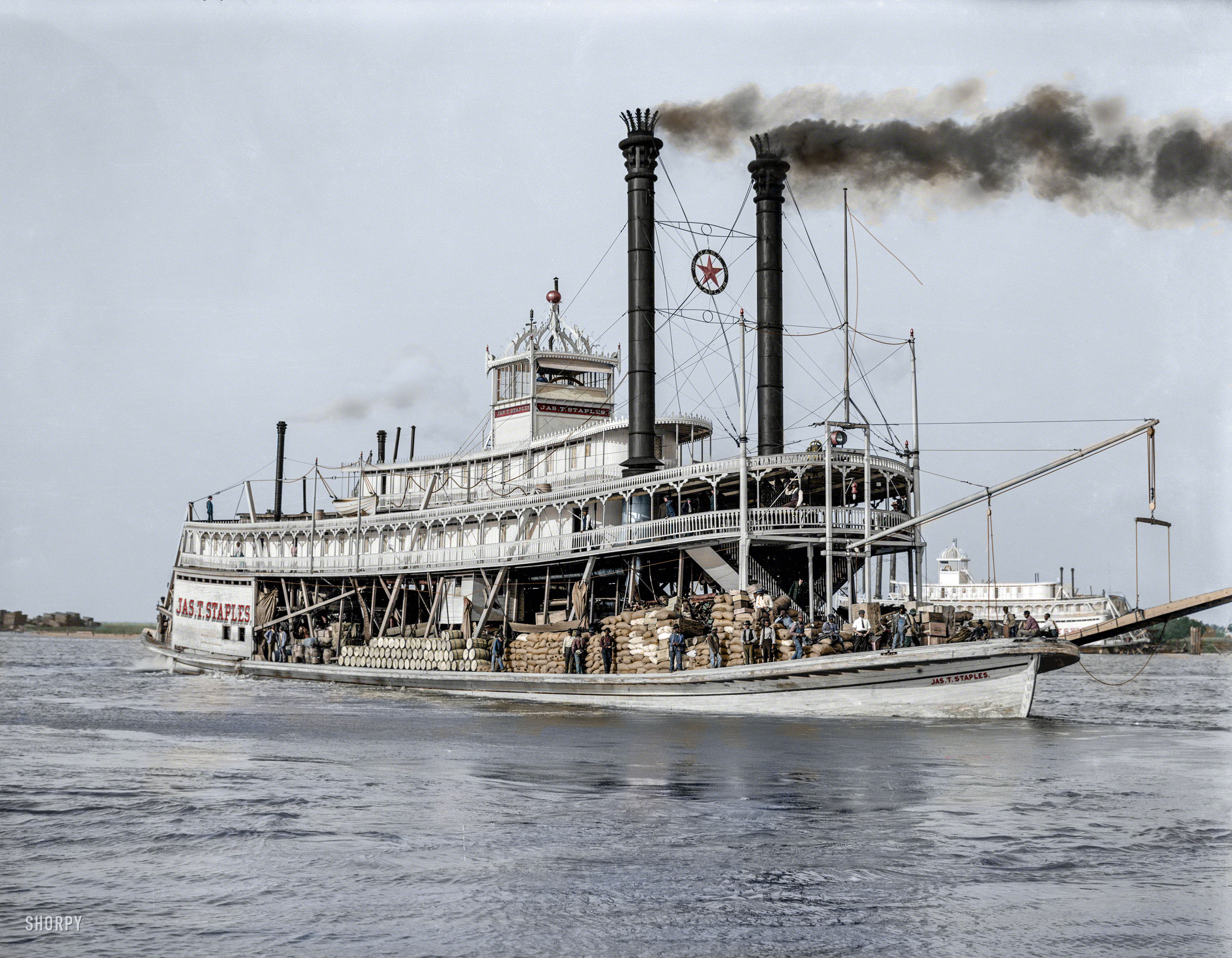 Colorized from this Shorpy original. A comment on the original b&w posting by fellow member Vidiot stated, "That's a strikingly different view of steamboat travel -- actual utilitarian work, transporting freight. Belies the romantic notion of white-suited gentlemen sipping sloe gin. I think I like this view better." I do agree, although to me, there is a gent seated on the second deck above the bow that does fulfill that romantic notion of a riverboat gambler. I can easily imagine that he would not have been a stranger to a deck of cards! View full size.