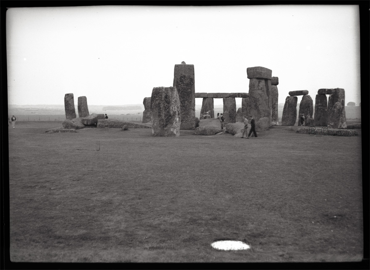 An interesting mix of tourists and what looks like students in the center of the picture. The white circle in the foreground is one of the Aubry holes. Scanned from the original 2.5 x 1.5 inch negative. View full size.