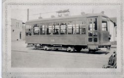 Taken in Vincenes, Indiana about 1930. View full size.
It&#039;s a Birney This is a Birney Safety Car. Bing or Google to find out all about them. They didn't fare too well in large cities. Note the single door. Large crowds getting on and off at rush hour was impossible and schedules were out the window from delays in loading those crowds.
Baltimore had some; after the problems with them were discovered, they mostly sat around car yards or worked low traffic or shuttle routes until sold off to smaller systems. 
They are popular with the model trolley fellows. You can get a nice Birney car in O scale and HO, probably in far greater numbers than were actually built in 1:1 scale.
(ShorpyBlog, Member Gallery)