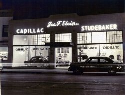 Obtained the image in a shop in Point Pleasant, NJ a few years ago. 8x10. View full size.
Studebaker nosesThose appear to be 1951 Studebakers. Same bullet nose as 1950, but part of its outer chrome ring was painted over for 1951, making it look narrower.
 Joseph F. Stein in Asbury ParkHemmings Blog grabbed your photo (mentioning your and Shorpy's names) providing information about the city where Joseph F. Stein had his Cadillac-Studebaker dealership: in Asbury Park, New Jersey, located on Main Street between Monroe and Sewall avenues.
(ShorpyBlog, Member Gallery, Cars, Trucks, Buses)