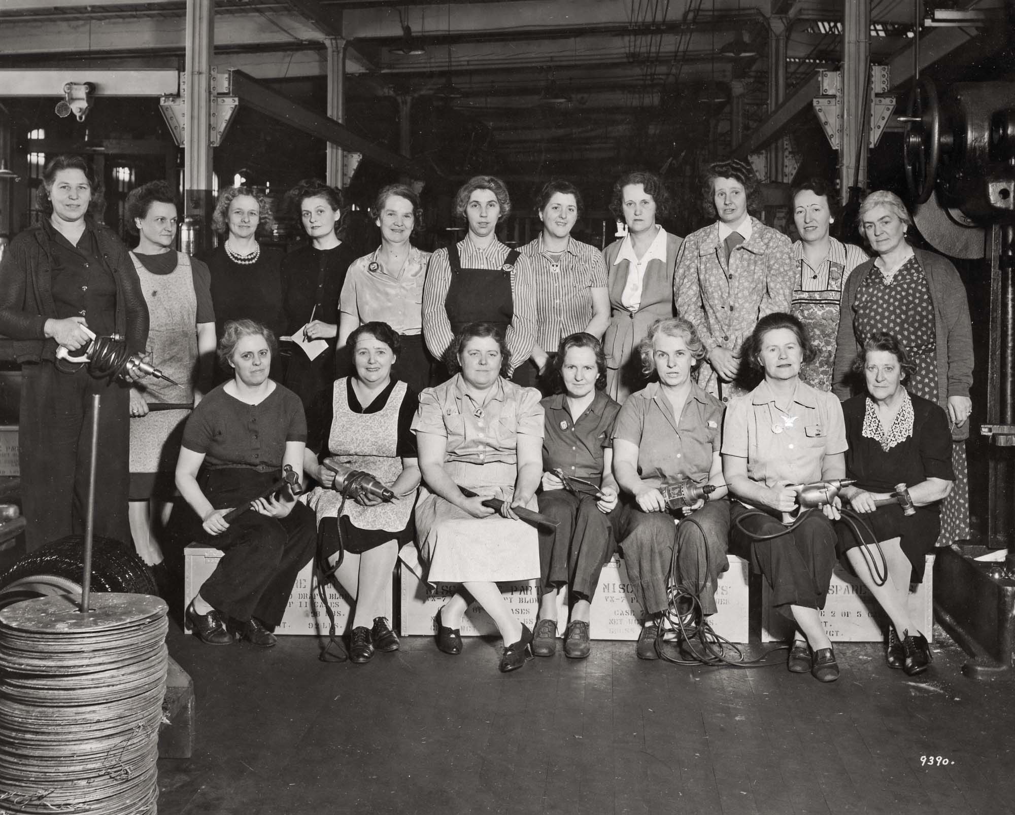 Hyde Park, Massachusetts, 1945. A group photo of women assembly workers, many with their tools, in Building C of the Sturtevant factory. A variety of commercial and industrial heaters were built in this building section.