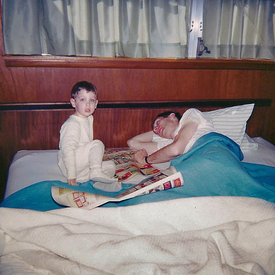 A Sunday morning circa 1964. I would fetch the Sunday paper so my father could read me the funnies. "Peanuts" and "Dennis the Menace" were my favorites. It is probably winter -- my "footy" pajamas would have been necessary in East Texas only in the coldest months. The house was built in 1957. Note the casement window crank and the Danish Modern headboard. I wish I still had my dad's Eames recliner and some of my mother's "mod" furniture. Polaroid scan. View full size.
