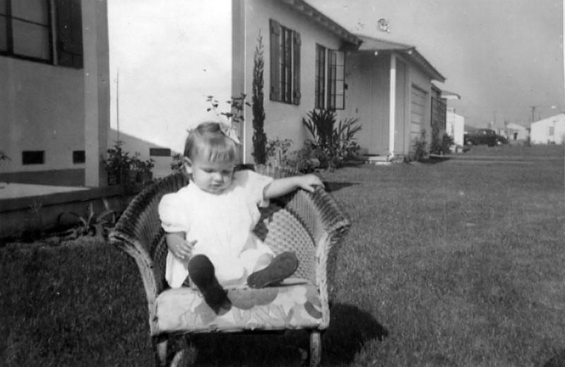 My aunt Susan (my dad's sister) taken in front of the family home in Los Angeles around 1942 (9025 Goebel Ave according to ration books). West LA near LAX. I had always thought suburbia started after the war. View full size.