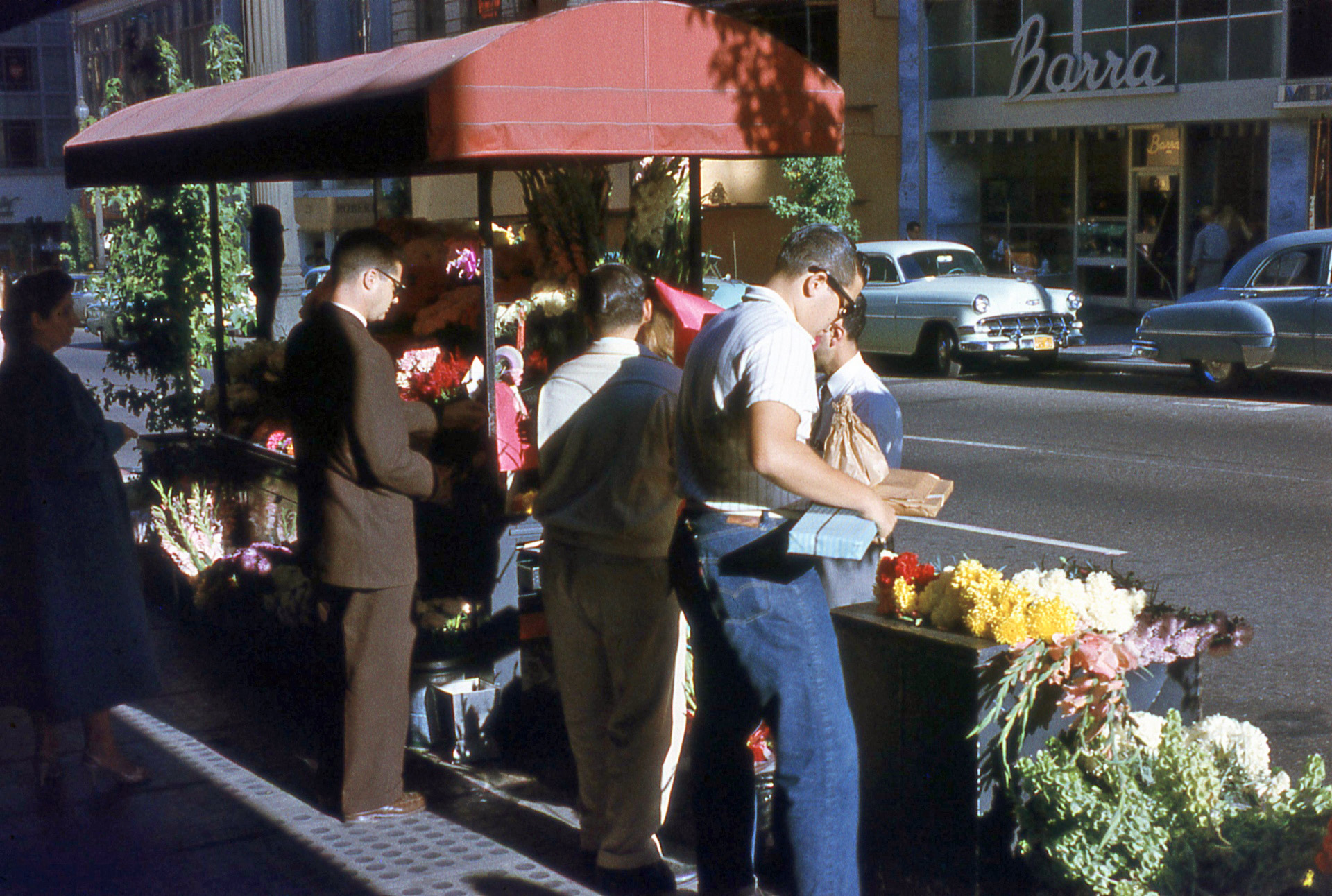 Another slide from San Francisco, where I grew up. This photo was taken on Sutter Street circa 1958. Shot on Anscochrome film, with surprisingly vivid colors!  They brought Flower Power to San Francisco well before the hippies arrived! View full size.