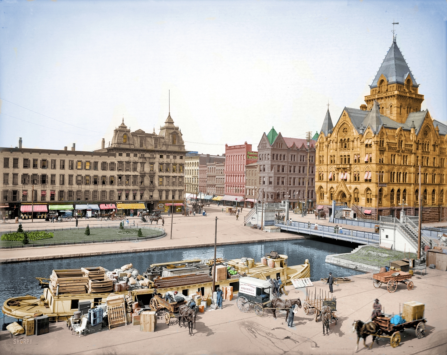 Colorized from this Shorpy original. Since some of the buildings in the picture are still there I tried to duplicate the colors as best I could. View full size.