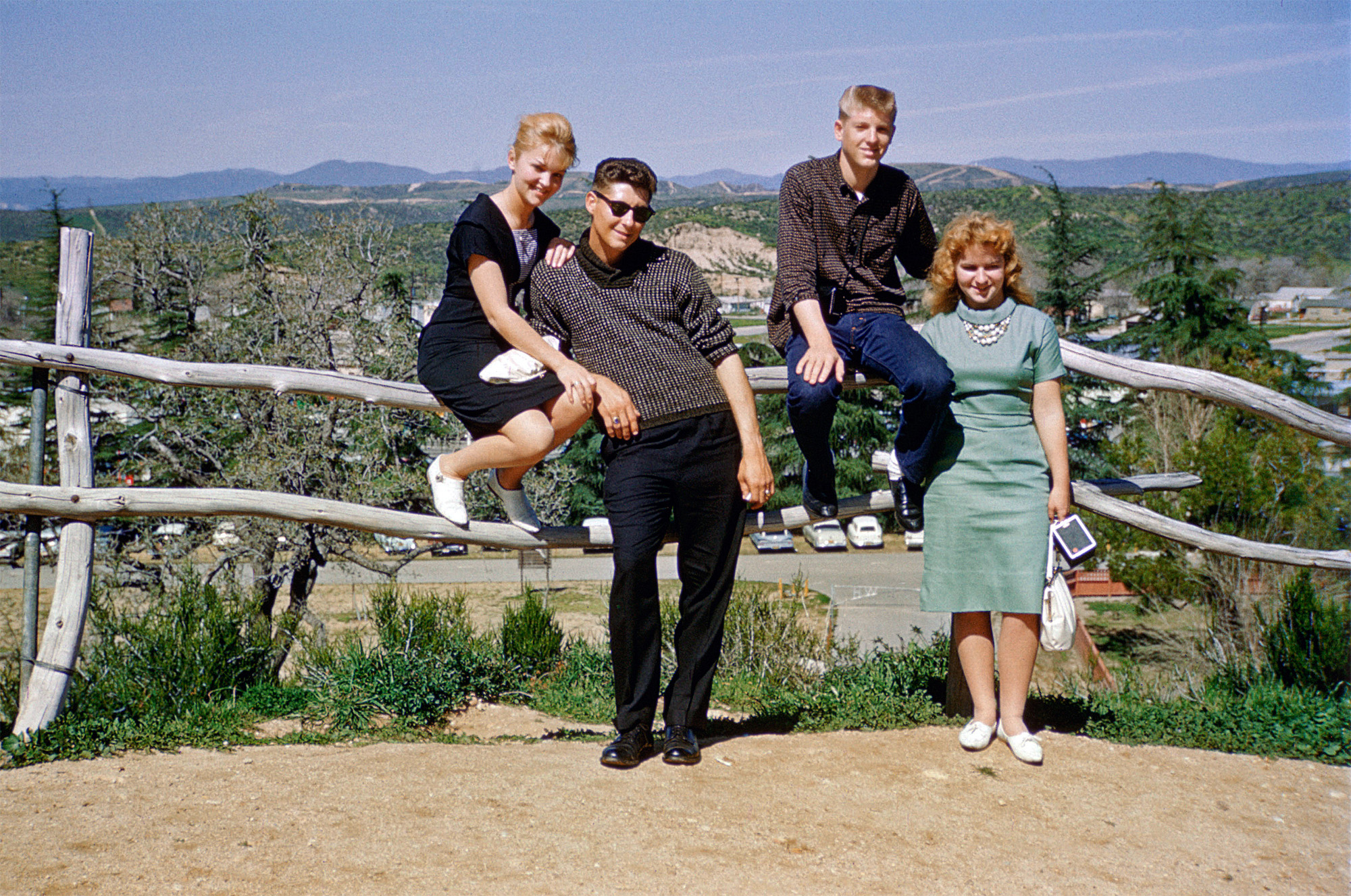 My sister-in-law, left, previously seen here with her Chevrolet Bel Air, in 1961 with her brother and friends in the foothills of the San Fernando Valley in Southern California. 35mm Kodachrome slide. View full size.

This was taken at the William Hart Ranch, now the William S. Hart Park and Museum, in Newhall, CA –- Deborah