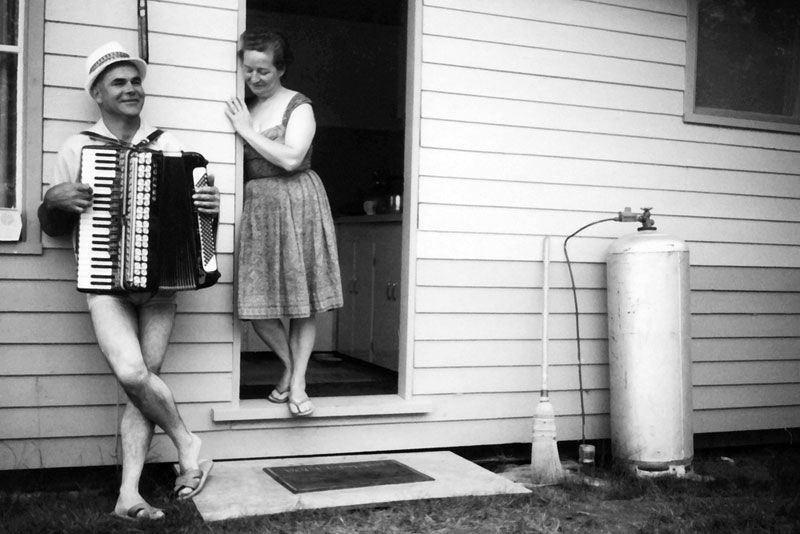 My Dad grew up in Europe where the accordion was a respected instrument. My Mom as you can see was a polite audience. About 1963, Pigeon Lake, Alberta, Canada . . . and yes he is wearing swim trucks. View full size.