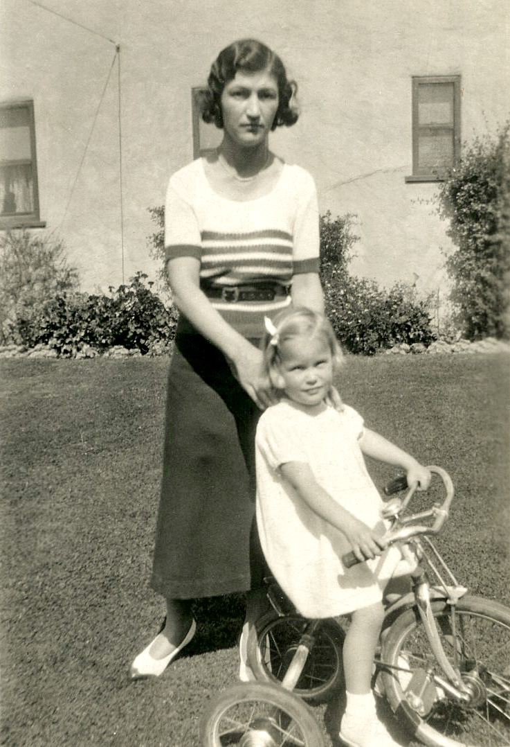 I thought this photo of a woman with a child on a tricycle (which dates to the 1930's or 1940's) was a mother and daughter until I read the back. It says: "Andre (Mary's maid) + Bobbie."
