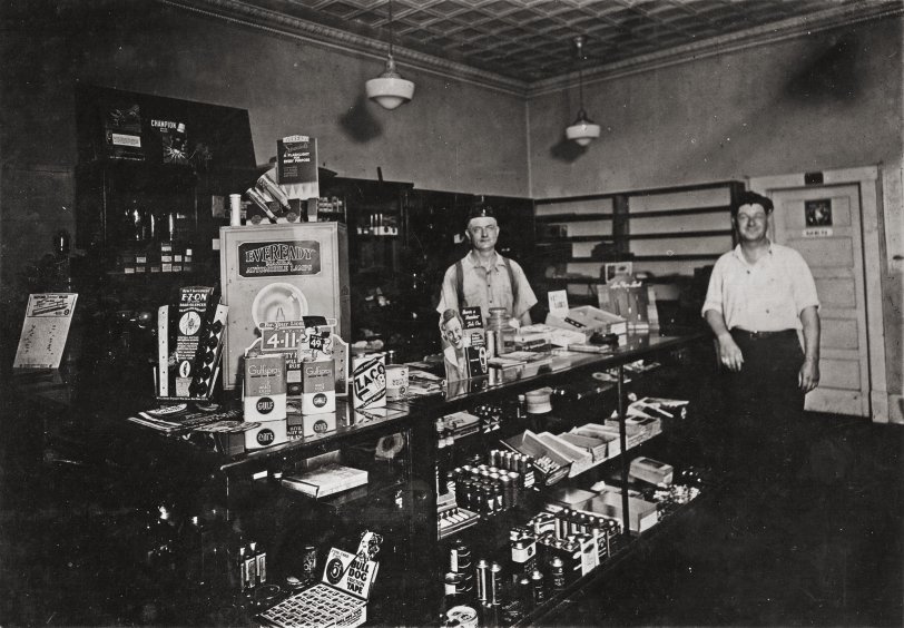 The Motor Shop, front counter, Barnegat, NJ, 1926. This was my great Uncle Sam's auto repair shop. He is the one at left. I'm not sure who the one is at right. He may be one of his brothers. 5"x7" photo purchased at an antique shop, which ironically is in the building next door to this one. This building now houses a flooring and carpet business.
