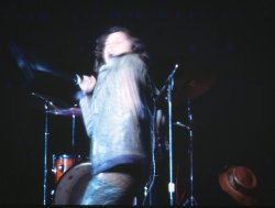 I was in 7th grade. I bagged 7th row seats at the Eastman Theater for The Doors one concert in Rochester -- at the height of their fame. I loved "When the Music's Over." I had my dad's camera. Took this just as he sang, "we want the world and we want it . . . ." and before "now." It's a little out of focus, but pretty memorable. View full size.
Blank Subject lineIt's rare this day and age to come across someone like you who has seen folks like Hendrix and The Doors live back in the day. I was 4 years old when this photo was taken. Seen many many bands since the early '70s myself, but Jim Morrison and The Doors were a fringe before my time. Very cool photo for you to always cherish!
Small venueGreat picture! I would have thought that the Doors would be playing a larger venue such as the War Memorial in 1968. With seventh row seats, it must have been memorable!
Another blank Subject lineFabulous!  Love the motion!
(ShorpyBlog, Member Gallery)
